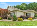 Well-maintained home with manicured landscaping and mature trees at 2561 26Th Ne Ave, Hickory, NC 28601