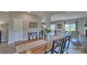 Inviting dining area featuring a wooden table set, neutral decor, and plenty of natural light at 4033 Cramer Estates Ct, Gastonia, NC 28056