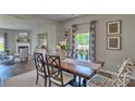 Cozy dining room with a view of the outdoors, stylish chairs, and a warm, inviting atmosphere at 4033 Cramer Estates Ct, Gastonia, NC 28056