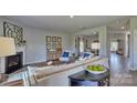 Comfortable living room with a fireplace, modern furnishings, and an open layout for entertaining at 4033 Cramer Estates Ct, Gastonia, NC 28056