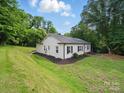 Well-maintained white brick home with manicured landscaping at 419 Wade St, Wadesboro, NC 28170