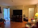 Comfortable living room with hardwood flooring, and neutral paint at 508 Hillcrest St, Marshville, NC 28103