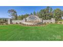 Stone signage marking the entrance to Shannon Woods community with lush green lawn at 6301 Fairfax Ct, Maiden, NC 28650