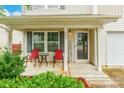 Inviting front porch with seating, perfect for relaxing and enjoying the outdoors at 693 Carybrook Ct, York, SC 29745