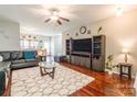 Bright living room featuring hardwood floors, modern furniture, and an open layout at 693 Carybrook Ct, York, SC 29745