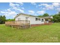 Lovely home featuring a spacious back deck for entertaining, complemented by a well-maintained lawn at 7990 W Nc 152 Hwy, Mooresville, NC 28115