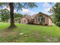 Well-maintained home with a green lawn, brick facade, and tasteful landscaping at 800 Isle Of Palms Ct, Fort Mill, SC 29708
