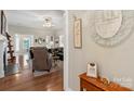 Inviting living room with hardwood floors, neutral tones, and comfortable seating arrangement at 800 Isle Of Palms Ct, Fort Mill, SC 29708