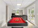 Spacious basement with a pool table and lounge area at 943 Shinnville Rd, Mooresville, NC 28115