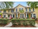 Attractive townhomes with yellow siding, white trim, and inviting front porches at 1123 Market St, Fort Mill, SC 29708