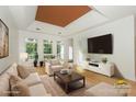 Bright living room with coffered ceilings, hardwood floors and large windows at 14831 Charterhouse Ln, Huntersville, NC 28078