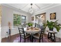Bright dining room featuring modern light fixture and large window offering plenty of natural light at 15416 Oleander Dr, Charlotte, NC 28278