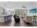 Open concept living room with hardwood floors and an abundance of natural light at 15416 Oleander Dr, Charlotte, NC 28278