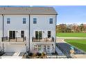 Modern townhome boasts white siding, private balconies, and a convenient attached garage for easy living at 1940 Westerhill Dr, Fort Mill, SC 29708