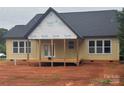 New home's covered back porch with wooden decking and support posts, offering a tranquil outdoor space at 2589 Polo Ln, Maiden, NC 28650