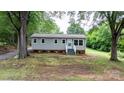 Charming one-story home featuring fresh landscaping and a welcoming entryway at 2980 N Church St, Claremont, NC 28610