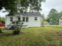Brick home showcasing a well-maintained lawn and simple landscaping at 317 Heilig Ave, Salisbury, NC 28144