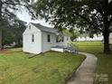 Home showcasing a manicured lawn, walkway and brick elevation at 317 Heilig Ave, Salisbury, NC 28144