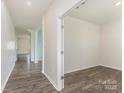 Hardwood hallway leading to a room at 347 Carolina Hemlock Dr # 141, Locust, NC 28097