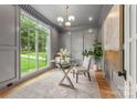 Elegant home office featuring paneled walls, natural light, and stylish decor at 5127 Lansing Dr, Charlotte, NC 28270
