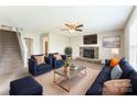 Inviting living room with stone fireplace, plush seating, and neutral tones creating a cozy atmosphere at 673 Shellbark Dr, Concord, NC 28025