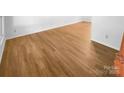 Close-up of the newly installed and gleaming hardwood flooring throughout the home at 7737 Batavia Ln, Charlotte, NC 28213