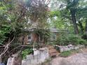 Secluded property with brick home set amongst the trees and foliage at 7949 Ritter Dr, Charlotte, NC 28270