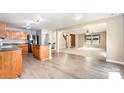 Kitchen and dining area in an open floor plan featuring hardwood floors and stainless appliances at 826 Sinclair Dr, Monroe, NC 28112