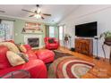 Inviting living room features a fireplace, hardwood floors, and lots of space at 9348 Golden Pond Dr, Charlotte, NC 28269