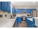 Eat-in kitchen boasts stainless appliances, subway tile, and ample counter space at 9524 Eagle Feathers Dr, Charlotte, NC 28214