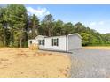 Charming home featuring a well-maintained front yard and a classic exterior design at 977 Myers Mill Rd, Olin, NC 28660