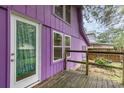 Close up of a purple house featuring a small wooden deck and a white glass door at 10 Cedarvilla Dr, Rock Hill, SC 29730