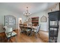 Elegant dining room with hardwood floors, chandelier, and classic furnishings at 10215 Balmoral Cir, Charlotte, NC 28210