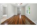 Sun-drenched living room featuring hardwood floors, neutral paint and an open design at 107 S Branch St, Monroe, NC 28112