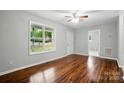 Spacious, sun-filled living room featuring hardwood floors and neutral paint at 107 S Branch St, Monroe, NC 28112