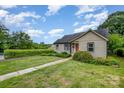 Charming house with a well manicured lawn and established trees adding to the curb appeal at 1125 Bethel Rd, Charlotte, NC 28208