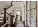 Grand foyer featuring hardwood floors, a staircase, and a view into the dining room at 1244 Weir Ct, Fort Mill, SC 29708
