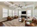 Bright living room boasting a coffered ceiling, ample seating, and large windows at 1244 Weir Ct, Fort Mill, SC 29708