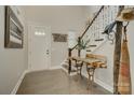 Bright and airy foyer featuring hardwood floors, a staircase, and unique decorative elements at 15344 Cimarron Hills Ln, Charlotte, NC 28278