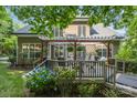 Beautiful backyard deck with pergola, outdoor seating, and lush landscaping for relaxing outdoor living at 154 Hunters Hill Dr, Statesville, NC 28677