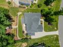 Birds eye view showing the house layout with a patio, landscaping, and well-maintained yard at 208 South Shore Dr, Belmont, NC 28012