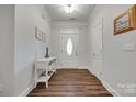 Bright entryway featuring modern flooring, decorative table, and an ornate front door at 268 Hillsborough Ln, Rock Hill, SC 29732