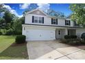 Two-story home with a white exterior, black shutters, and an attached garage with a well-maintained lawn at 3349 Ellingford Rd, Charlotte, NC 28214
