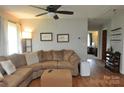 Comfortable living room with a large sectional sofa, wood floors, and adjacent office space at 3505 Valley Dr, Chester, SC 29706