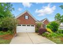 Lovely brick home with a well-maintained lawn and colorful landscaping, offering great curb appeal and a welcoming entrance at 6007 Edinburgh Ln # 214, Indian Land, SC 29707