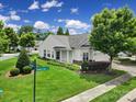 Attractive home on a corner lot with lush green lawn, mature tree, and well-maintained landscaping at 9020 Smokey Hill Ln, Fort Mill, SC 29707