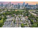 A high angle view showing the cityscape with modern buildings and a dense residential area with green trees at 925 Westbrook Dr # B, Charlotte, NC 28202