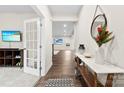 Inviting hallway with dark wood floors and views to the living room at 1022 Hinson Forest Rd, Monroe, NC 28110