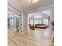 Inviting living room featuring high ceilings, a fan, and natural light at 118 Tayport Dr, Troutman, NC 28166