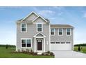 Exterior elevation of a gray, two-story home with a covered entryway and an attached two-car garage at 12013 Beaux Art Ln, Charlotte, NC 28214